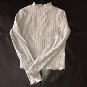 Turtleneck with ruffled ends